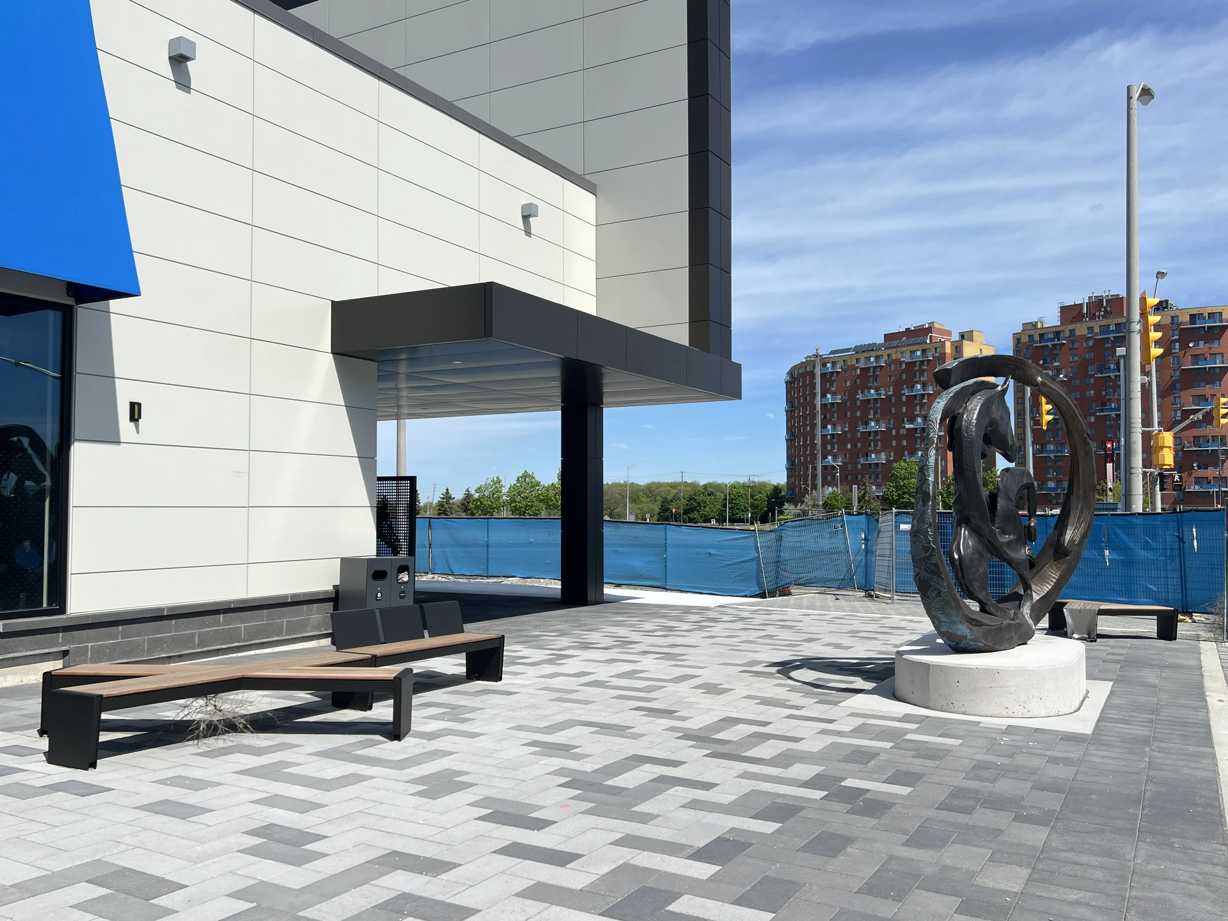 Woodbine Block 9 — Patterned paving, seating and public-space elements.