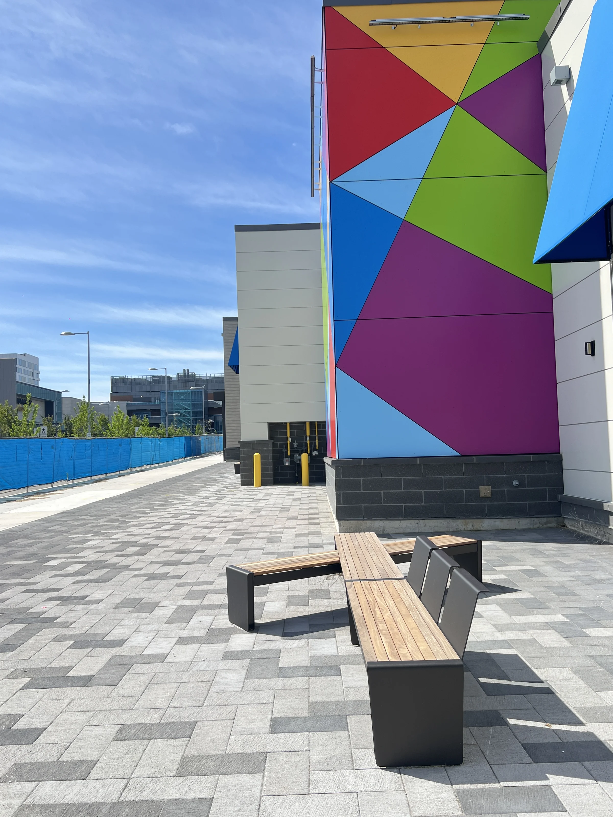 Woodbine Block 9 — Paving, seating and colourful building frontage.